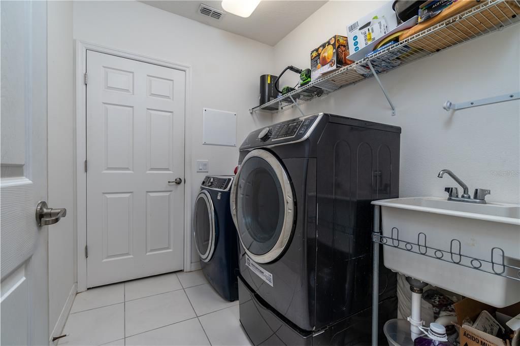 Laundry room with direct access to the master closet and bathroom