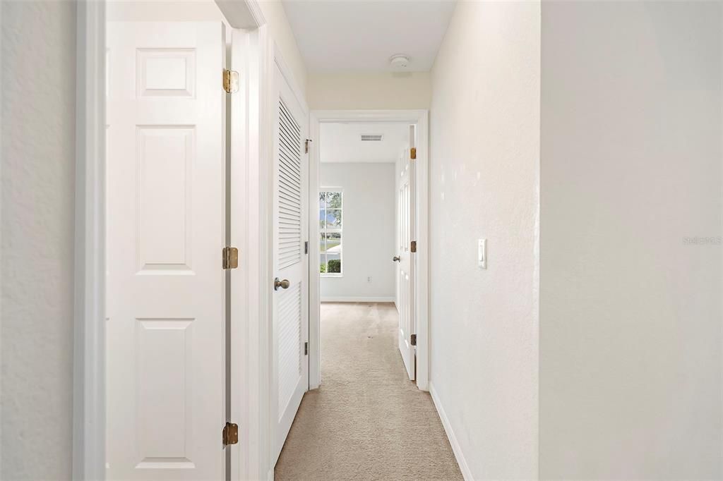 Guest hallway view into front bedroom