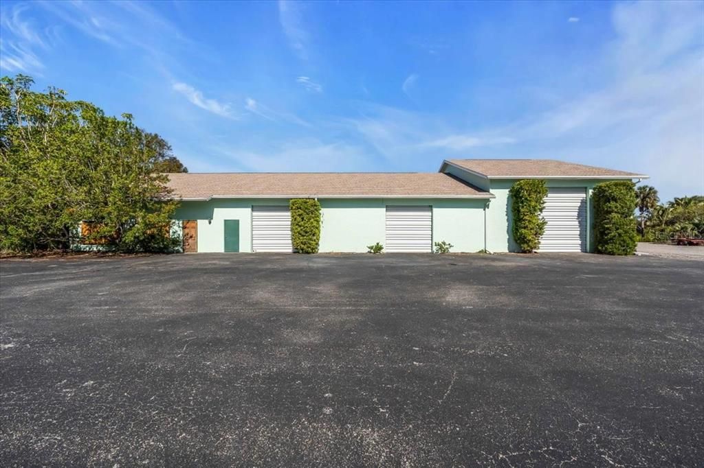 Left side is entrance to offices and hobby shop; right side is garage overhead doors