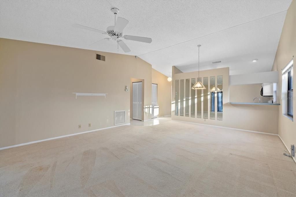 Living/Dining Room Combo with pass through window from the Kitchen