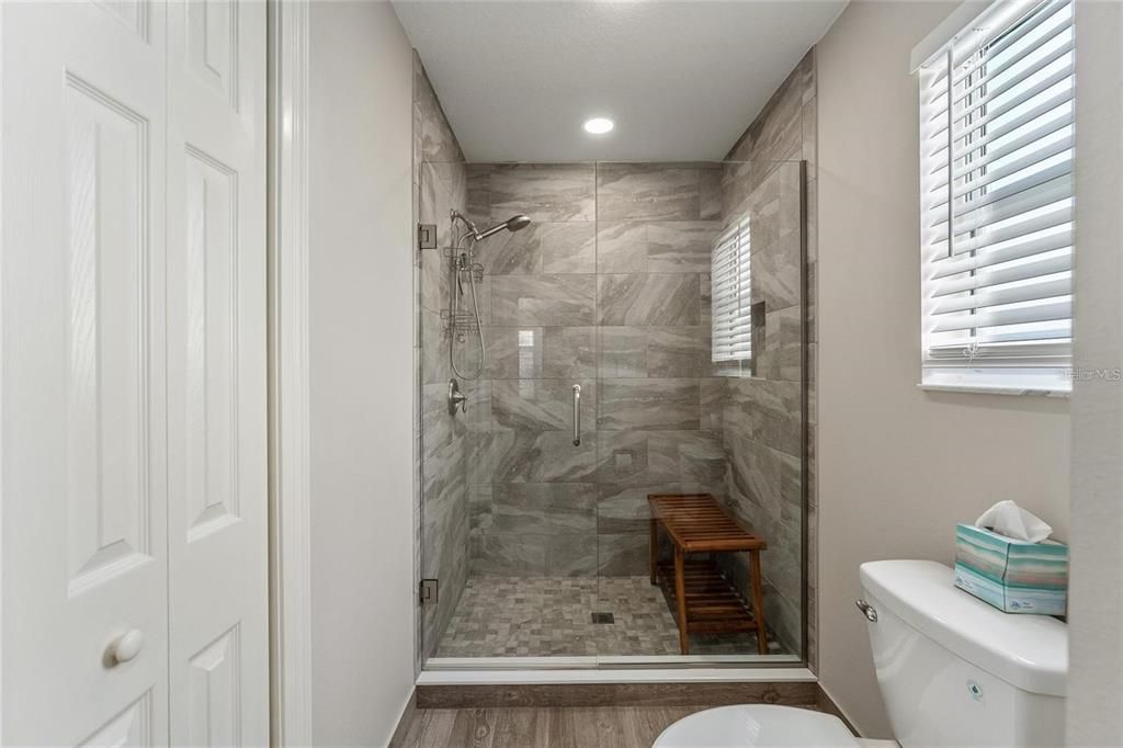 ABSOLUTELY GORGEOUS WALK-IN SHOWER WITH FRAMELESS GLASS DOOR AND STUNNING TILE!!!