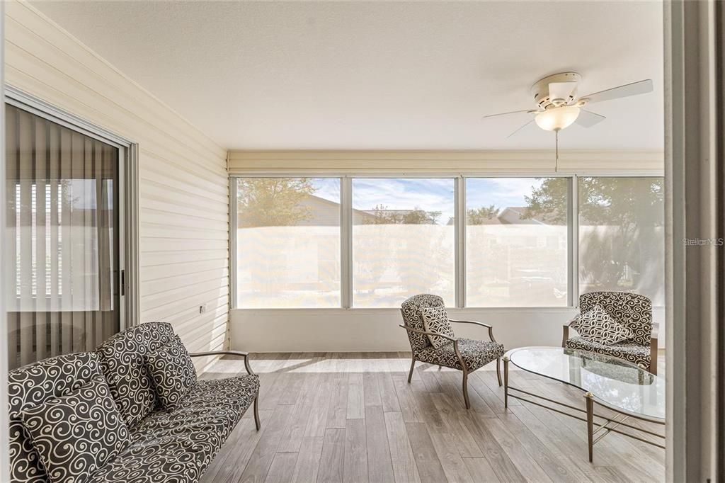 OVERSIZED ENCLOSED LANAI HAS GORGEOUS FLOORING THROUGHOUT!