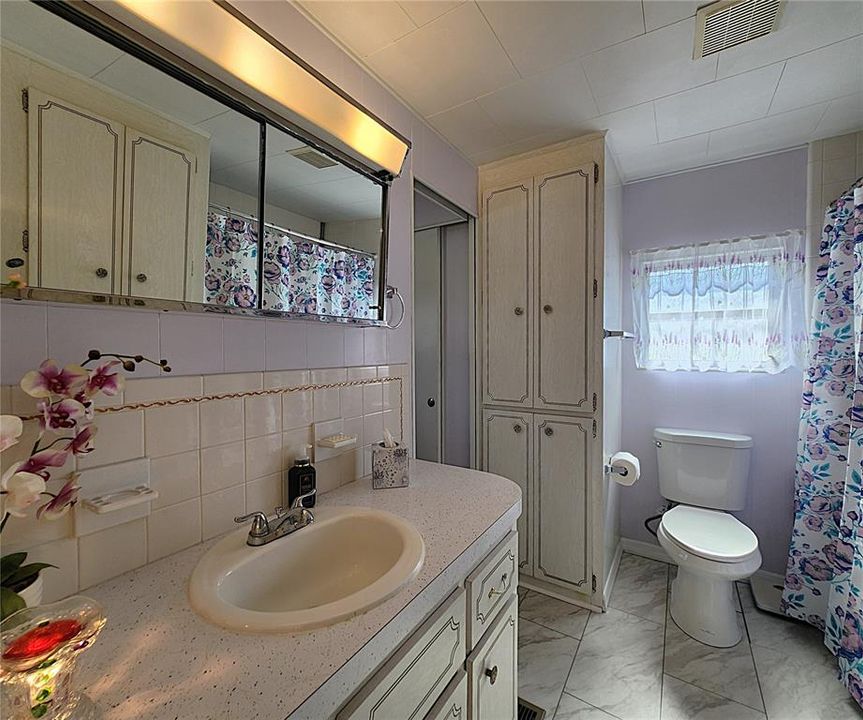 Master bath includes a tiled shower and bathtub