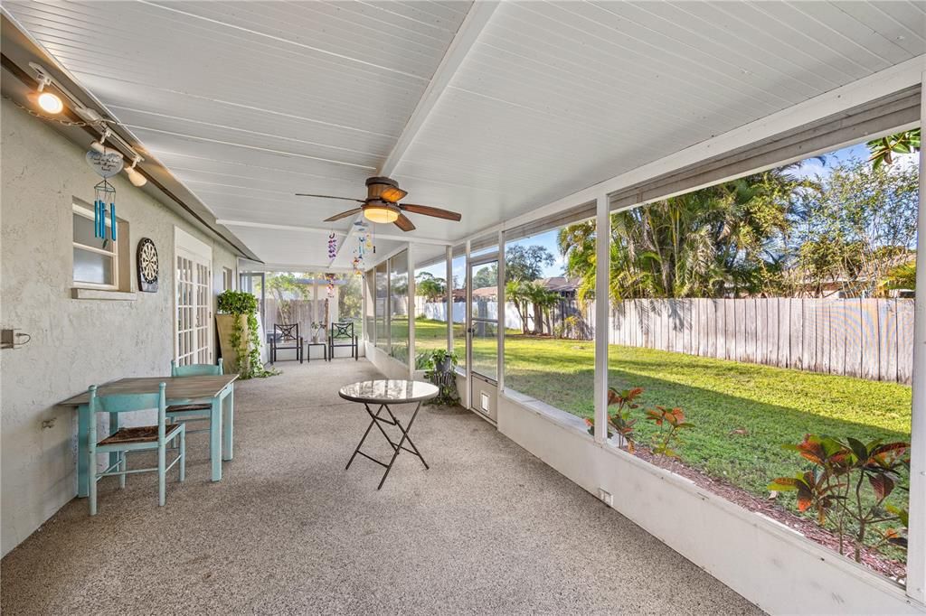 Pass through window from kitchen to your expansive lanai is on other side of French Doors.