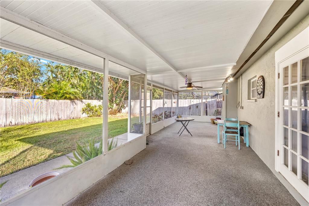 expansive lanai that runs the whole length of the home.  Front doors to the right lead to the dining room.