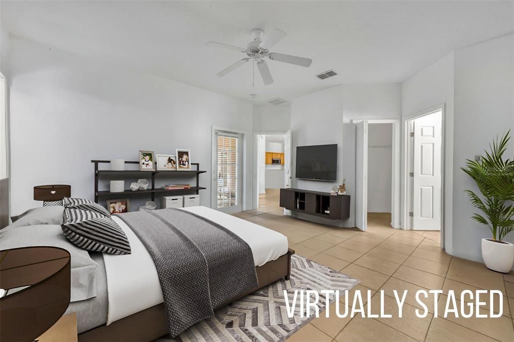 Primary bedroom - virtually staged with view of en suite bathroom