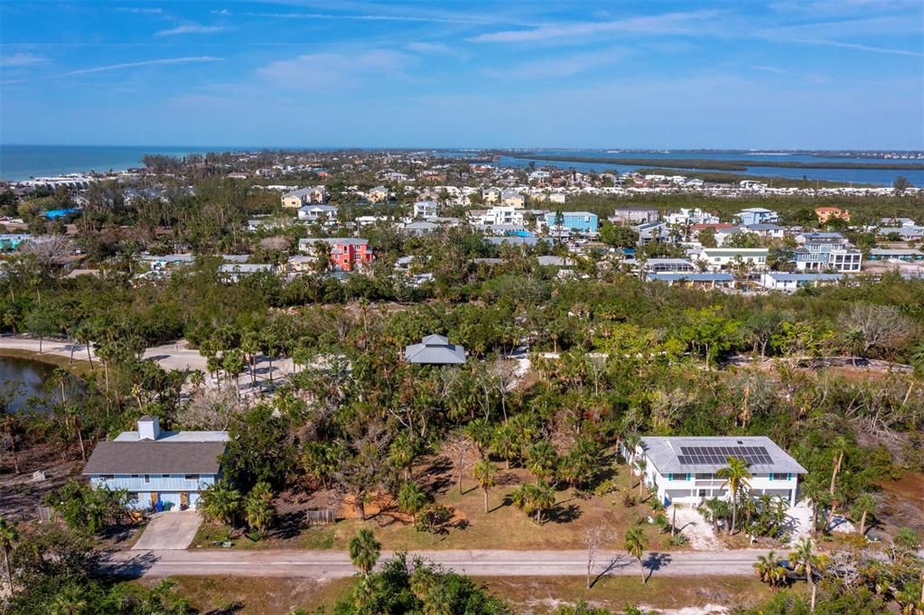 Situated perfectly, this mid-key location is offers the best of both worlds with deeded beach and bay access.