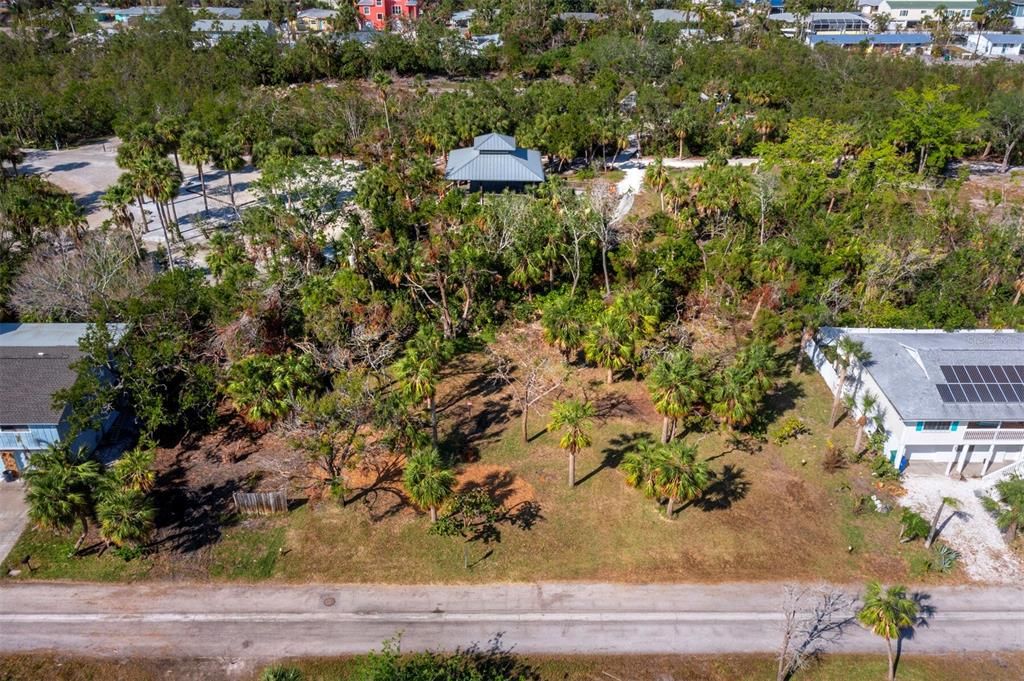 This generous sized lot backs up to the Joan Durante Park. Imagine being able to access all the park amenities and walking trails through your backyard gate.