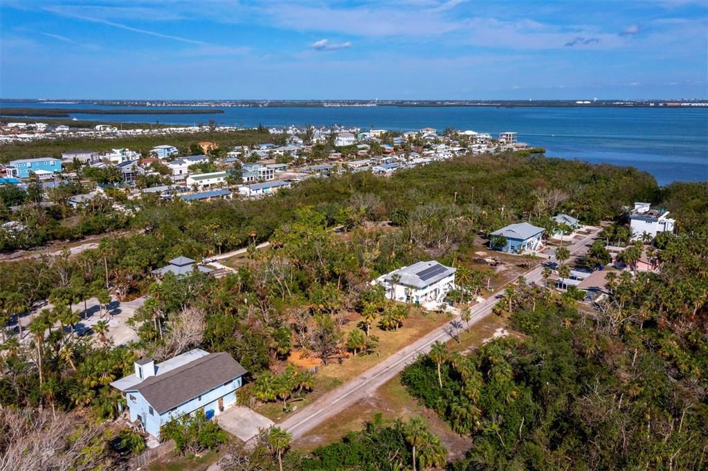 Looking northwest, Sarasota Bay is just a short stroll away. Accessible from the streets end and the neighboring park, with lookout points and a kayak launch.