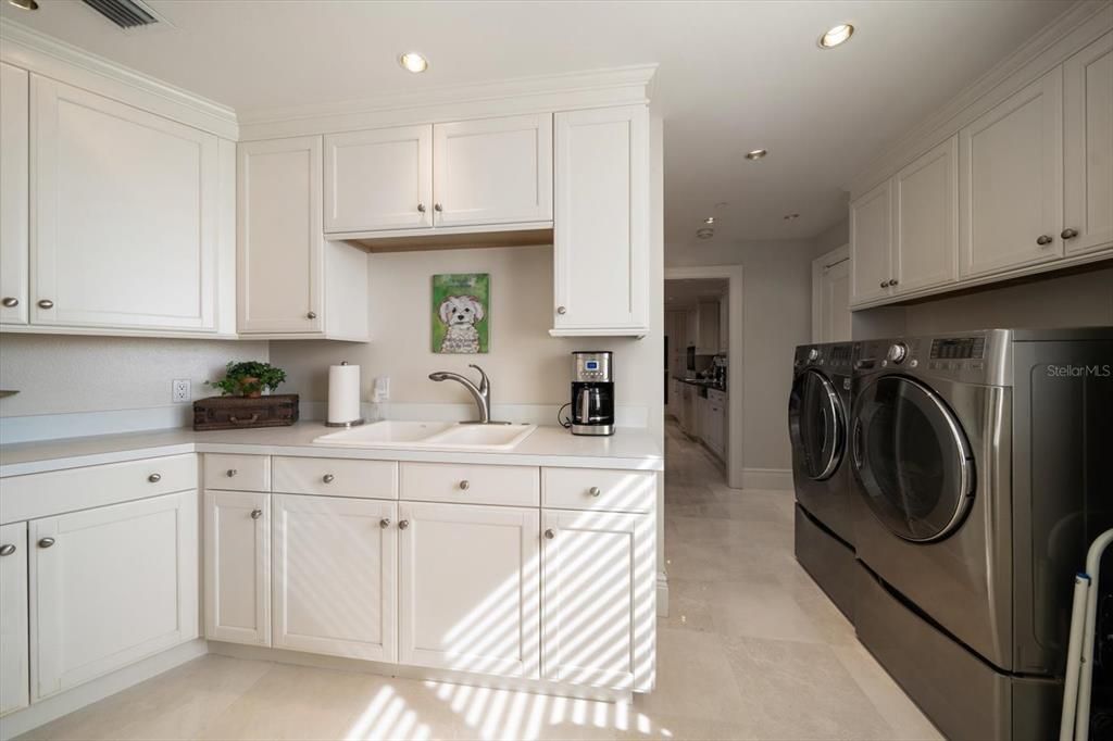 Laundry area has fabulous space and storage!