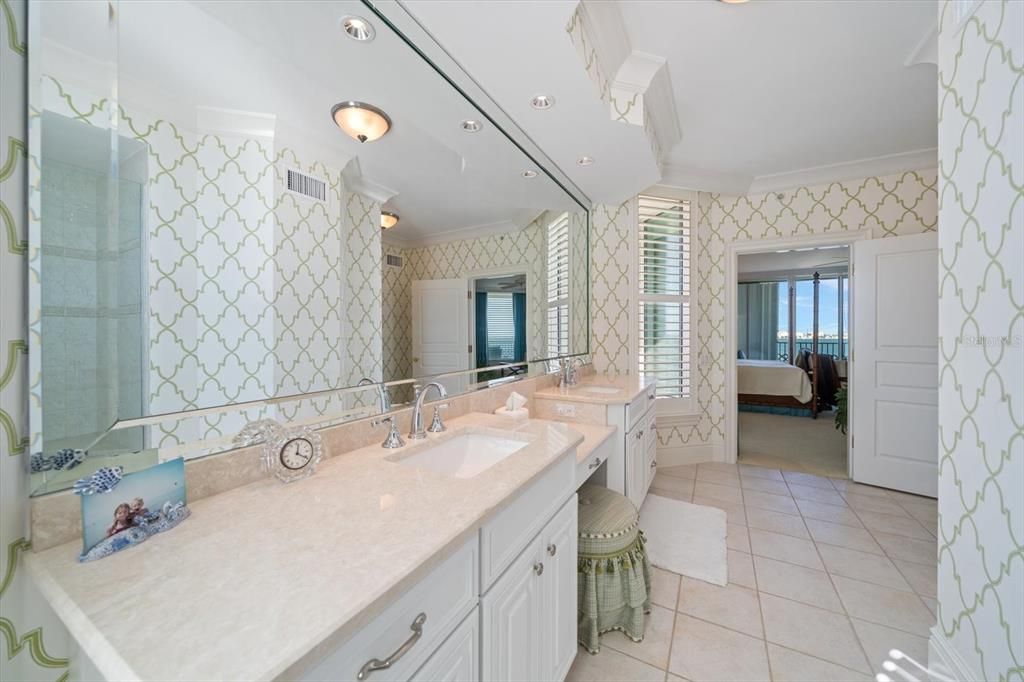 Ensuite guest bathroom area with double vanities and walk-in shower.