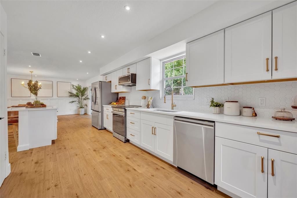 Whether your washing dishes by hand, or loading them into the dishwasher this home has a good view from any angle.