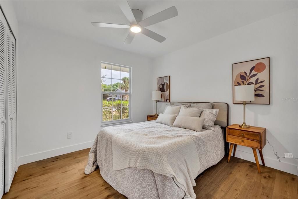 Second bedroom with spacious closet and remote controlled fan.