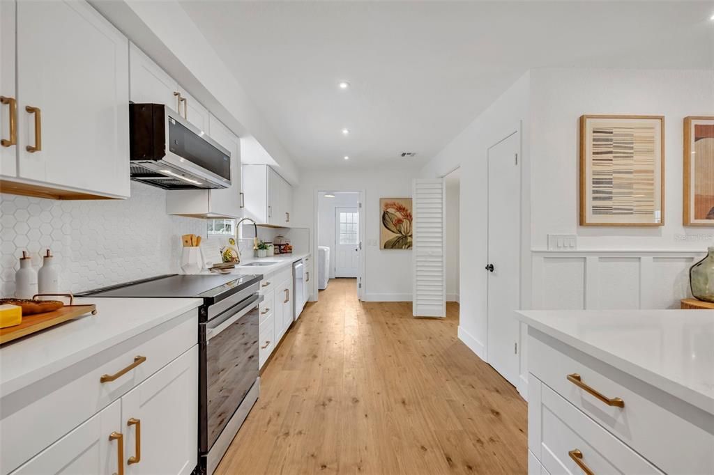 Huge walk-in pantry next to another pantry makes this space just even more spacious.