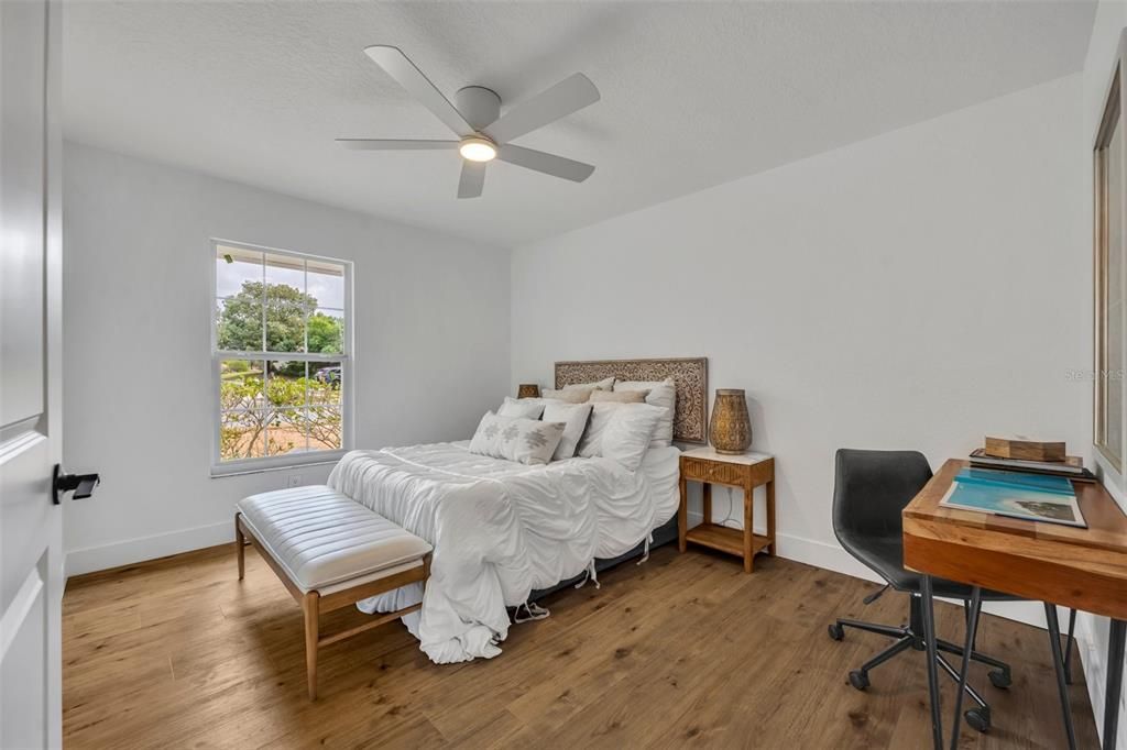 The third bedroom is larger and has a lot of space to put a desk or armoire for extra closet space.