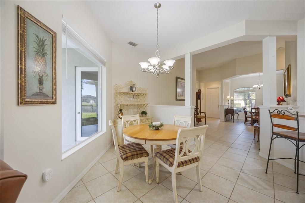 Dinette adjacent to Kitchen overlooking lanai through large aquarium window.