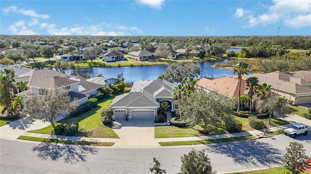 Serene lake water views behind him 12343 Lavender Loop Bradenton, FL 34212 Greyhawk Landing