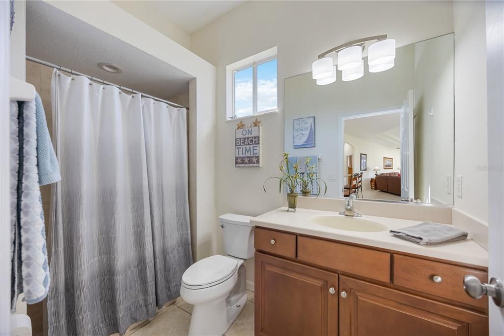 Third bathroom in the back of home situated next to fourth bedroom