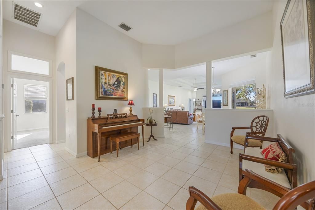 Living room sits directly in front of entrance creating a central flow throughout home