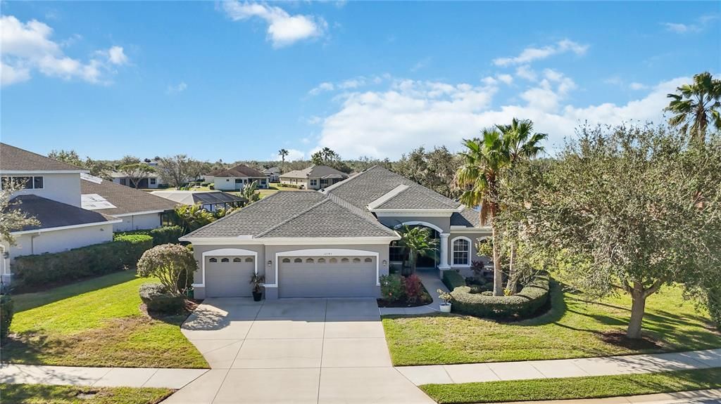 3 car garage with cement paved driveway with ample storage space for all your cars and toys