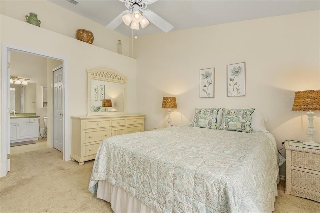 Primary Bedroom-View of lake, Spacious suite with vaulted ceiling, walk-in closet