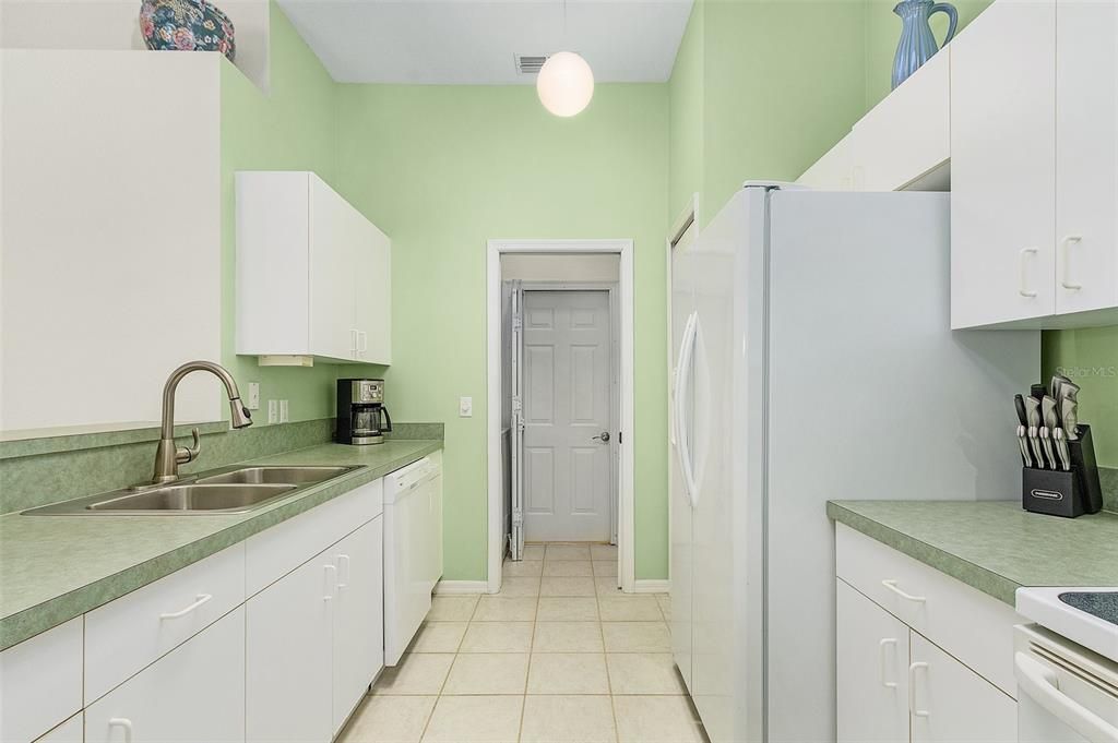 Pantry, pocket door to laundry room,  tons of natural light from skylight -Kitchen fully equiped,