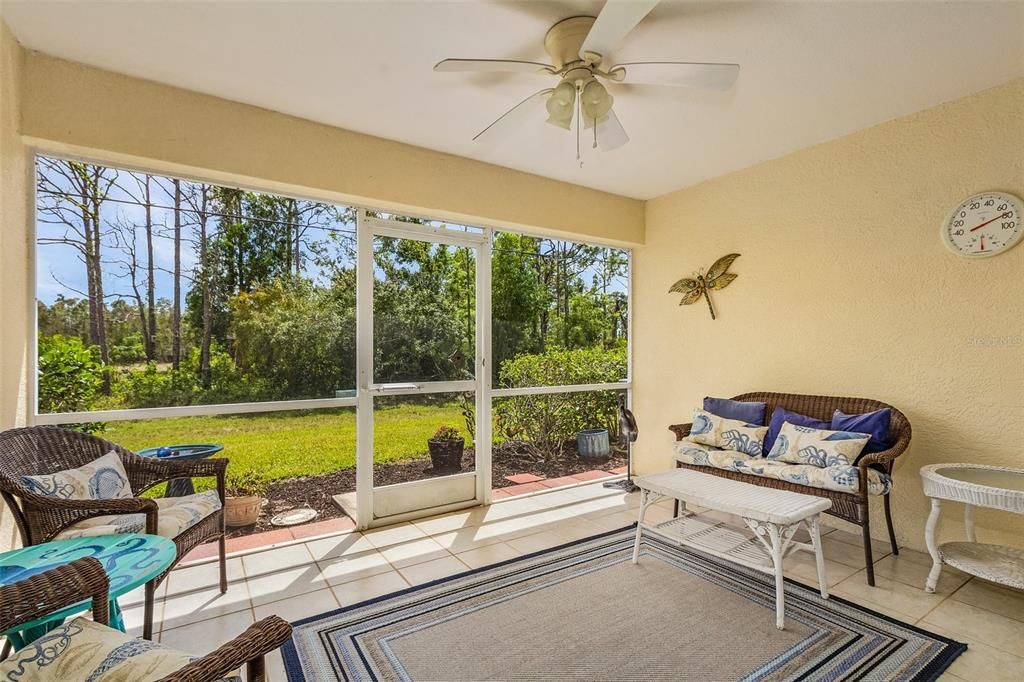 Enjoy your morning coffee in the screened enclosed Patio with view of Lake,