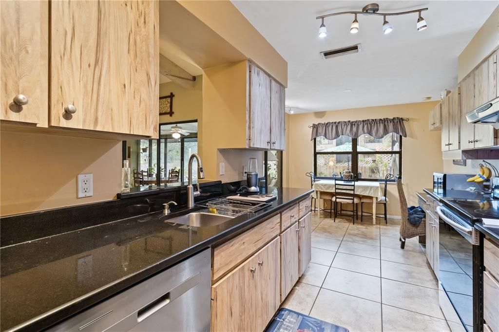 Kitchen opens to breakfast area