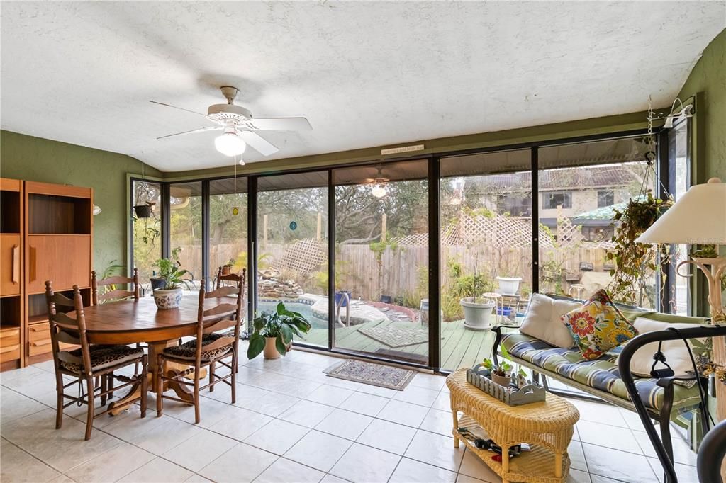 Enclosed lanai opens to pool