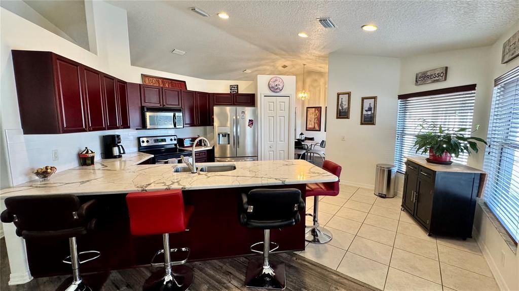 Remodeled Kitchen w/ Quartz Counter Tops and Newer SS appliances.