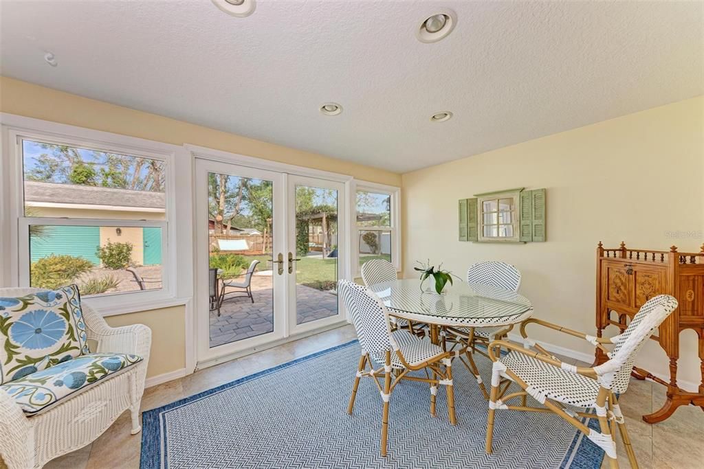 Cheery Sunroom overlooking the large landscaped back yard