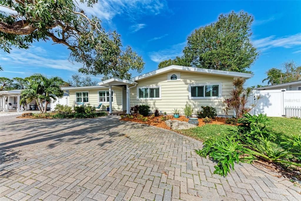 Beautiful brick pavered circular driveway.