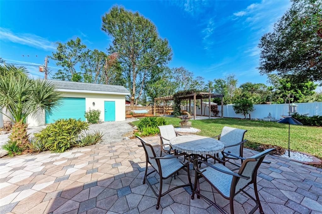 Amazing backyard with a pergola and firepit.   Great outdoor space to relax or entertain.