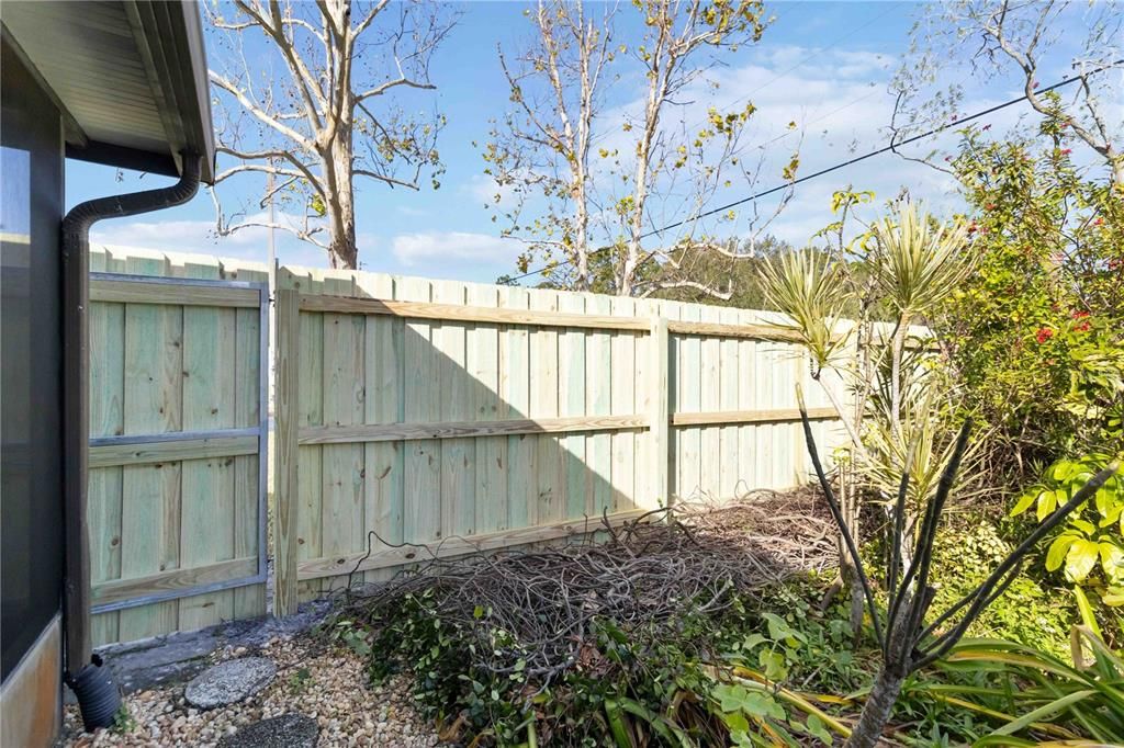 Selllers decided to replace the fence, now there is fencing all around the back of the home.