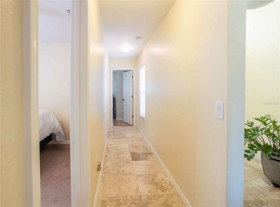 hallway leading to bedrooms 2, 3, 4 and 2nd bath