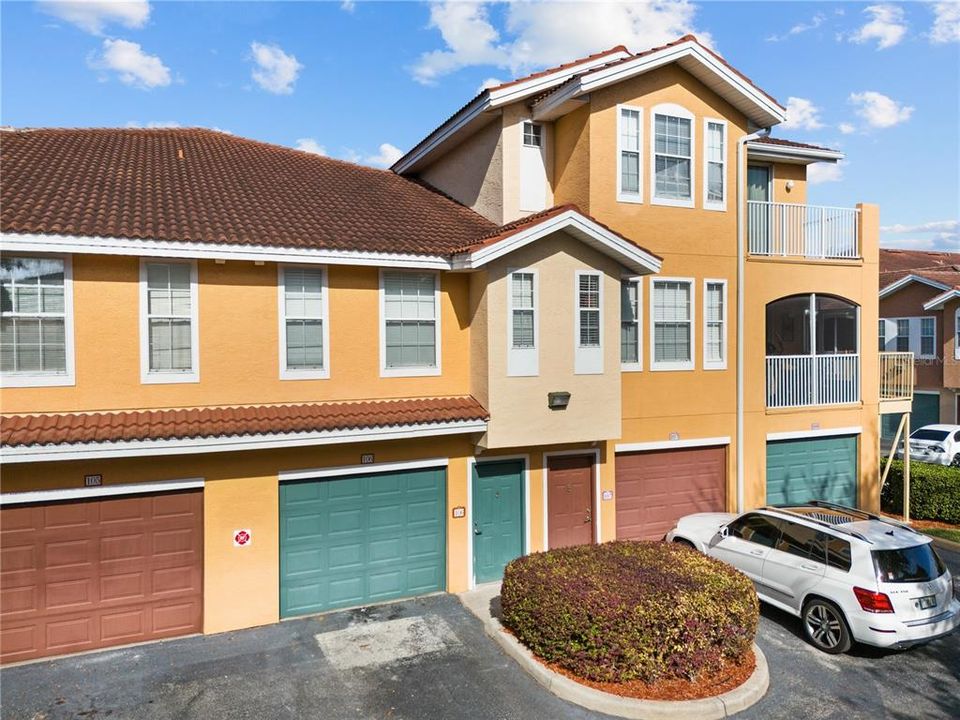 Green garage and front door to unit 106.