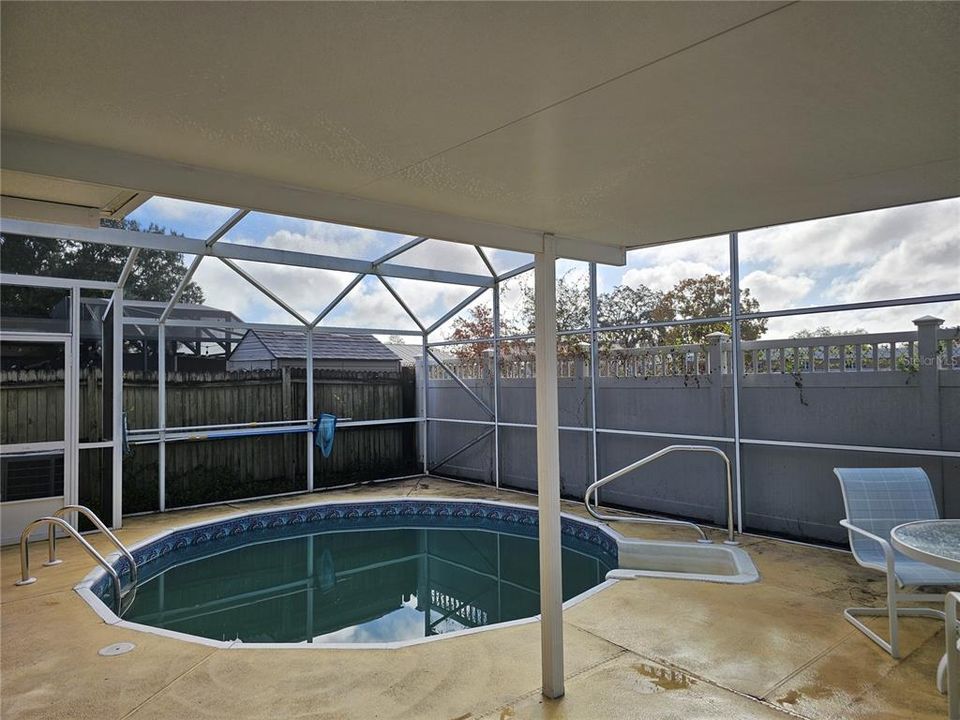 Screened enclosed pool/patio.