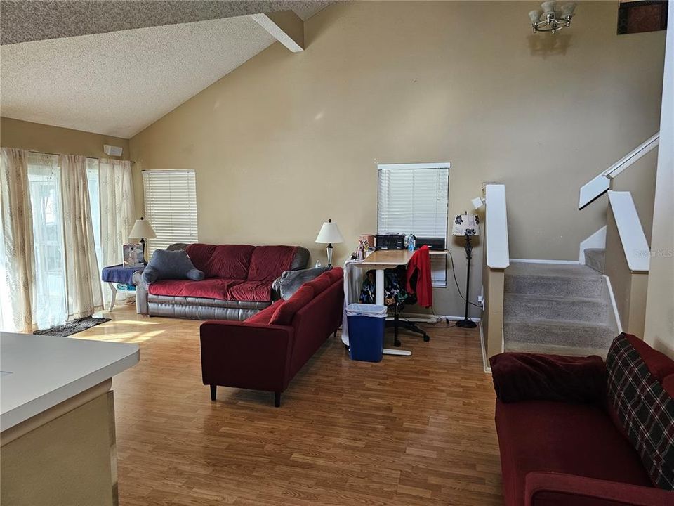 View of living room and staircase from the dining room.