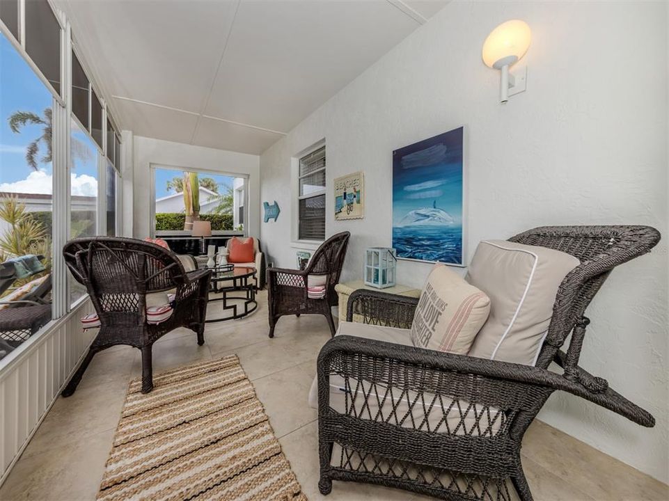 Screened in lanai has the same tile flowing throughout home so everything matches nicely and tastefully.