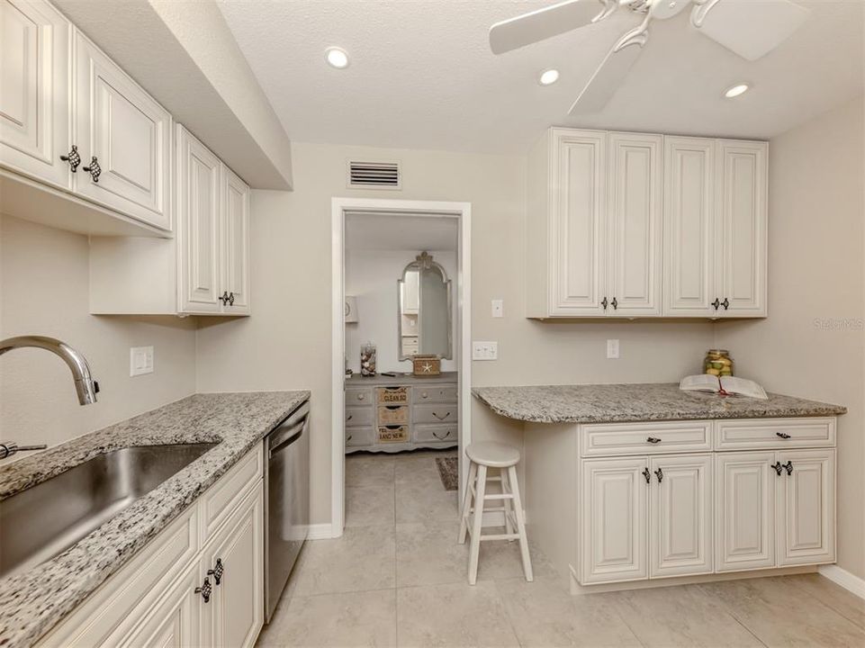 Take notice of the spacious granite countertops to aid with your kitchen prepping.