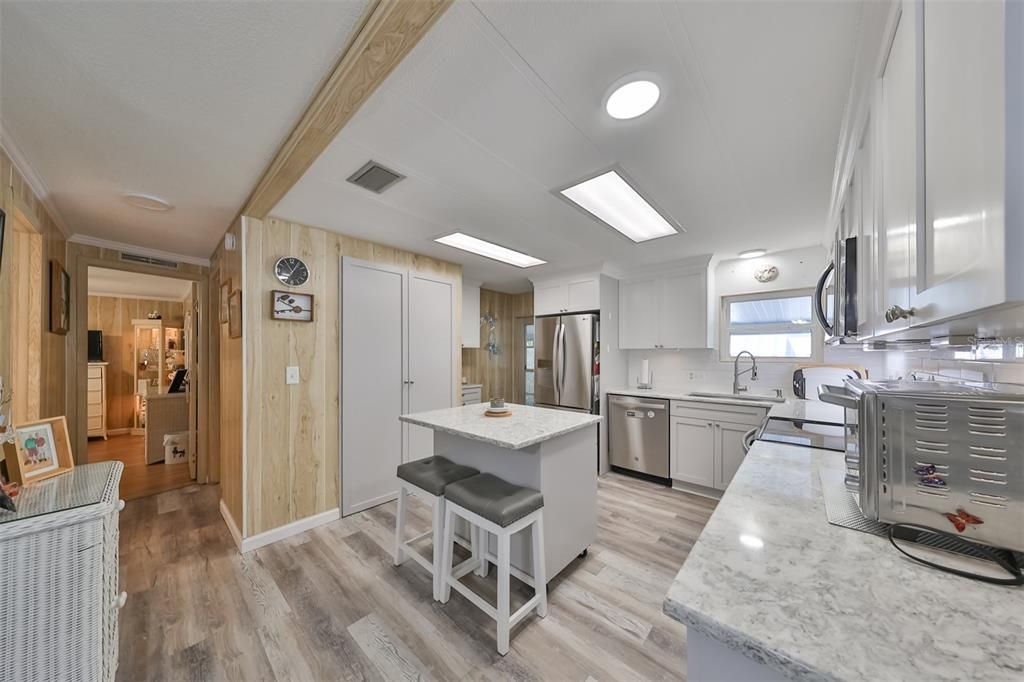 Kitchen is awesome! Hard surface counter tops .. Behind those doors is crazy pantry storage!