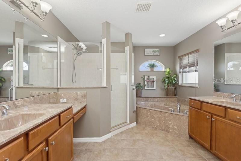 Master ensuite with double vanities, shower and tub