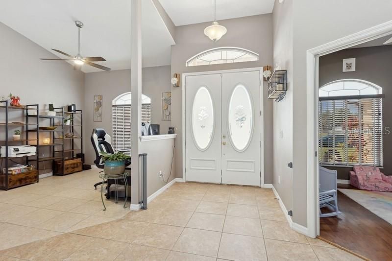 Entrance into living area with formal dining at entrance