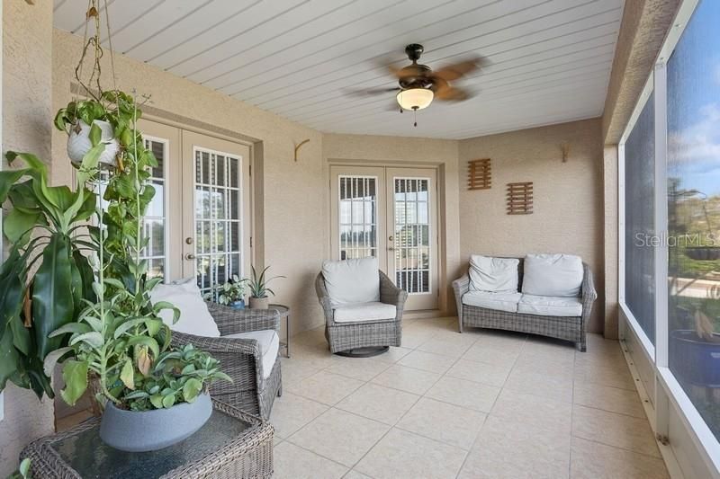 Rear screened patio access from Master, living and family rooms