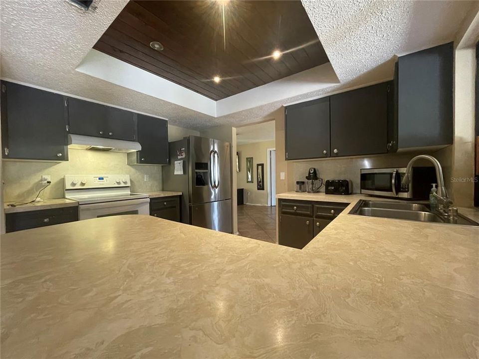 wood accent ceiling at kitchen