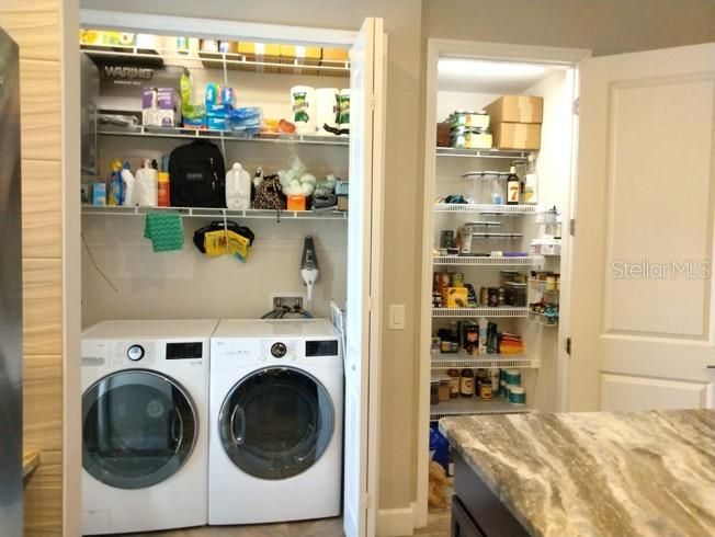 Laundry closet with new LG washer/dryer and large pantry