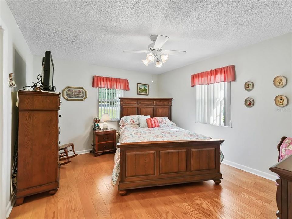 PRIMARY BEDROOM WITH HARDWOOD FLOORS