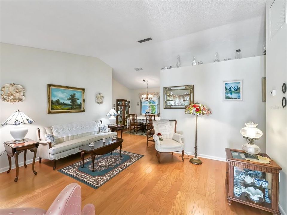 FORMAL LIVING ROOM WITH HARDWOOD FLOORS, CATHEDRAL CEILINGS