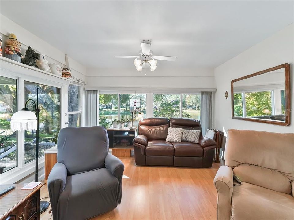 FAMILY ROOM WITH GLASS WINDOWS ACROSS BACK