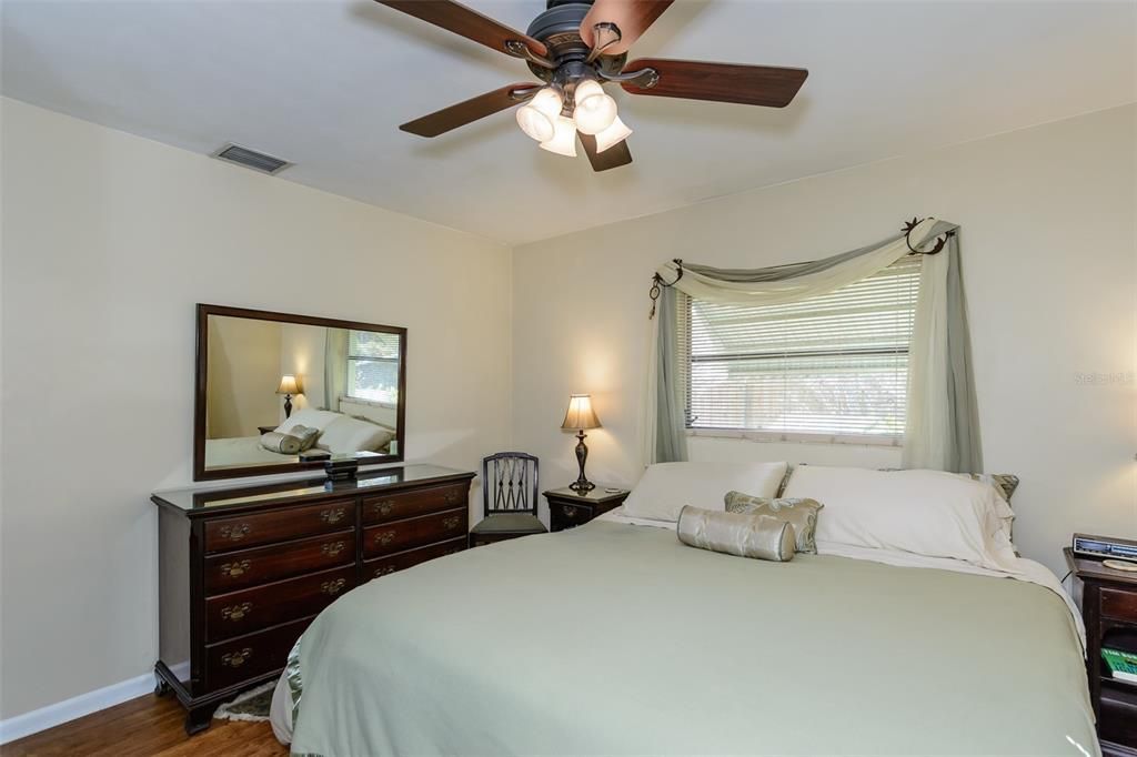 Both corner bedrooms offer two windows and ceiling fans.